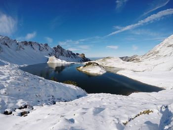 Scenic view of mountains against sky during winter