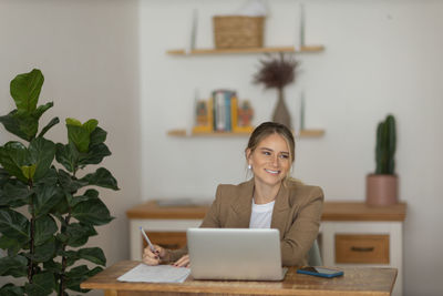 Woman working at home with laptop. home office.  notebook for working. 