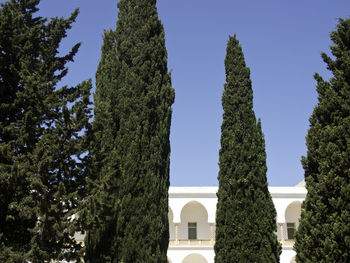 Low angle view of historic building against clear blue sky