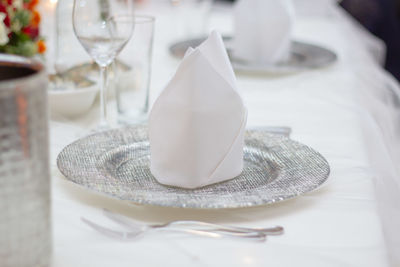 Close-up of white drinking glass on table