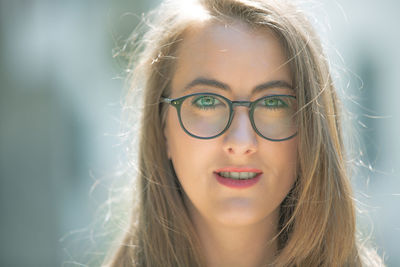 Close-up portrait of woman wearing eyeglasses