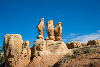 Hoodoos standing against a clear blue sky