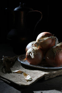 Close-up of cocktail on table against black background