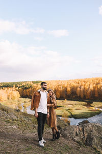 Full length of man walking on field