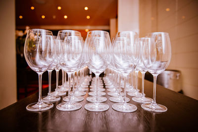 Drinking glass on table in restaurant