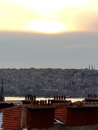 Buildings in town at sunset