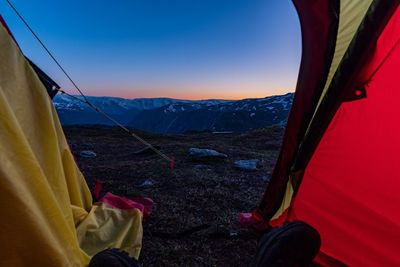 Low section of tent on mountain against sky