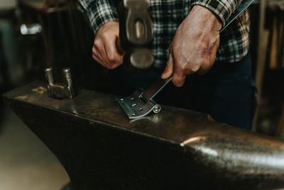 Close-up of man working on table