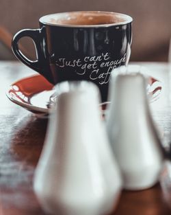 Close-up of coffee cup on table