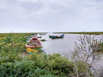 Abandoned ship in water against sky
