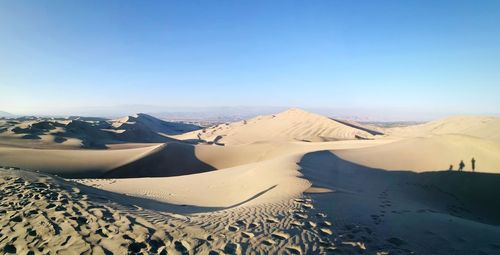 View of desert against clear sky