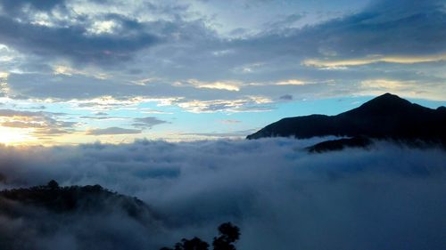 Low angle view of silhouette mountain against sky