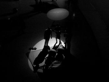 Men relaxing in darkroom