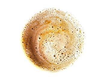 Close-up of coffee cup against white background