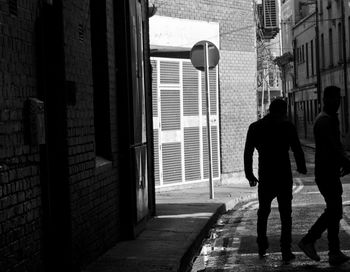 People walking in alley of streets