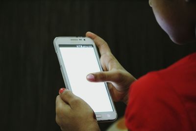 Close-up of woman using mobile phone