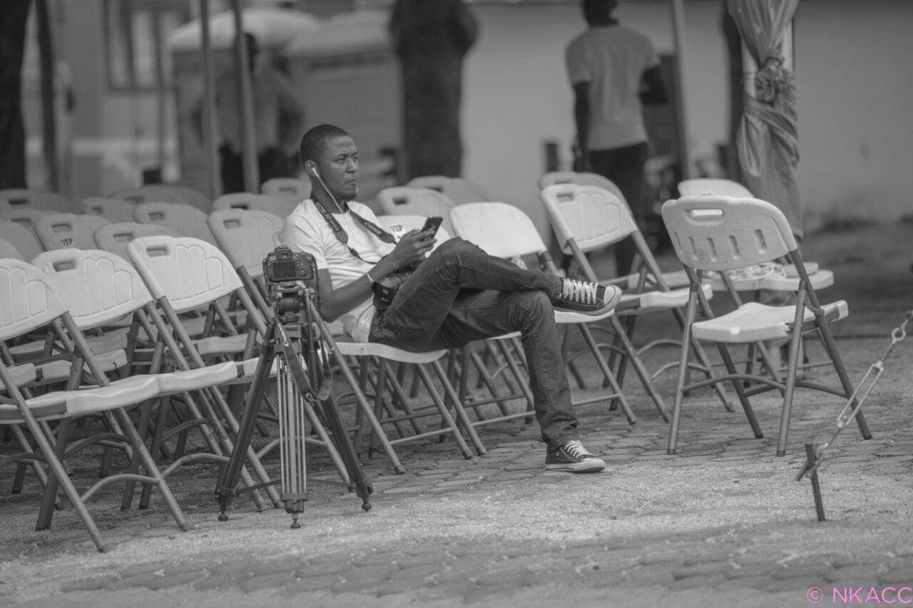 chair, focus on foreground, day, full length, table, side view, outdoors, music, leisure activity, working, sitting, lifestyles, childhood, occupation, musical instrument, incidental people, skill, arts culture and entertainment