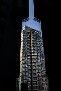 Low angle view of modern buildings in city at night