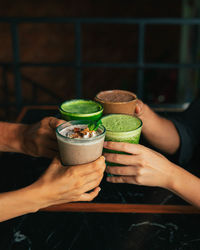 Midsection of woman holding drink