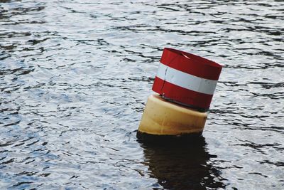 High angle view of red umbrella on water