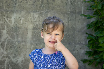 Portrait of smiling girl standing outdoors