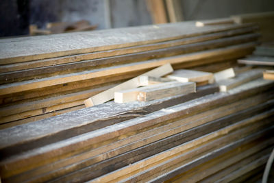 Wood working industry stack of wooden planking lath board joist table close up front view. 