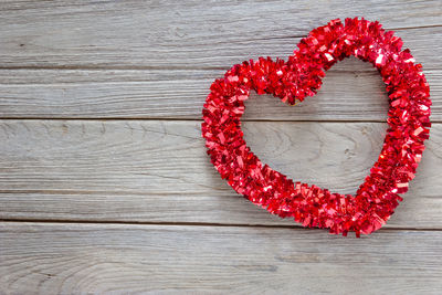 Directly above shot of heart shapes on wooden table