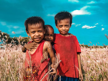 Portrait of smiling boy on field