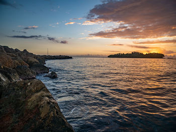 Scenic view of sea against sky during sunset