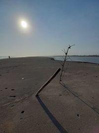 Scenic view of beach against clear sky