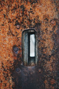 Close-up of rusty metal with hole