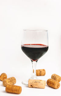 Close-up of beer glass against white background