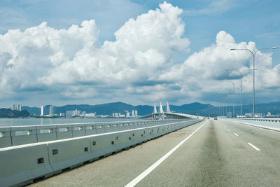 Travel by road  bridge against sky