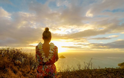 Woman watching sunset