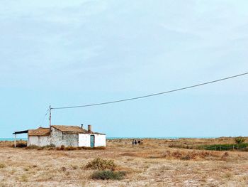 House on field against sky