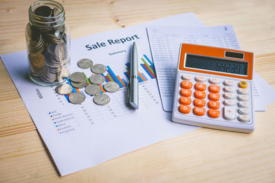 High angle view of coins on table