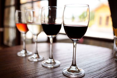 Close-up of wine glasses on table