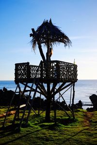 Gazebo in sea against clear sky