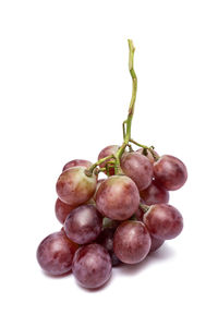 Close-up of grapes against white background