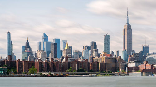 Modern buildings in city against sky new york