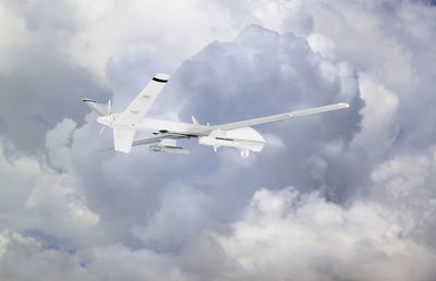 Low angle view of airplane flying in sky