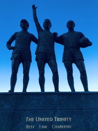 Low angle view of statue against sky