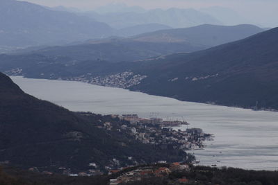 High angle view of buildings and mountains against sky