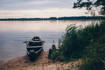 Boat in lake against sky