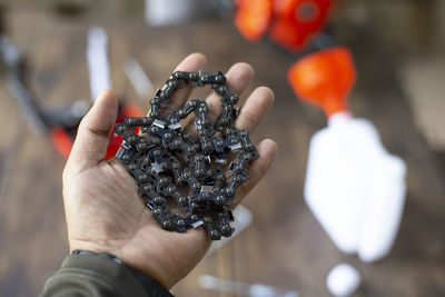 Cropped hand of person holding christmas tree