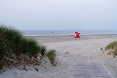 Scenic view of beach against clear sky