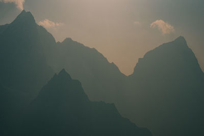 Low angle view of silhouette mountain against sky during sunset