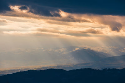 Low angle view of dramatic sky during sunset