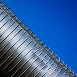 Low angle view of building against clear blue sky