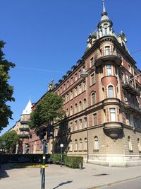 Buildings against clear blue sky